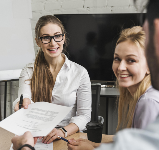 Employees reviewing hr compliance and payroll compliance procedures